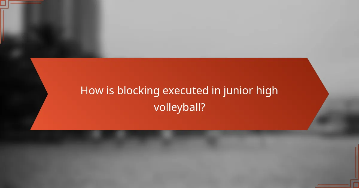How is blocking executed in junior high volleyball?
