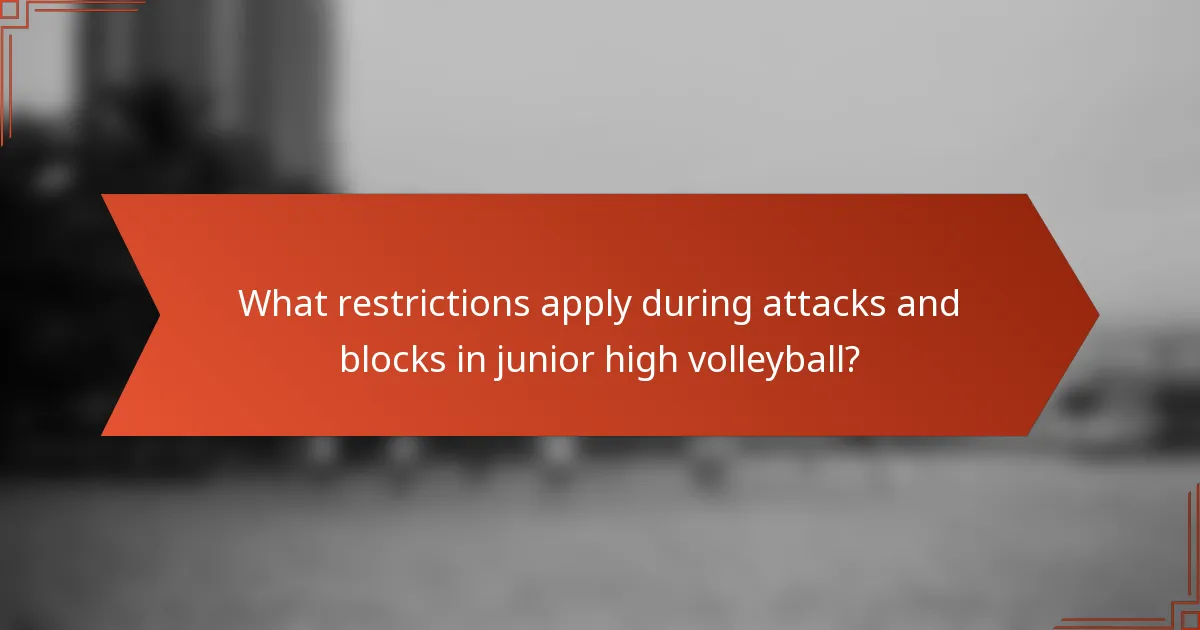 What restrictions apply during attacks and blocks in junior high volleyball?